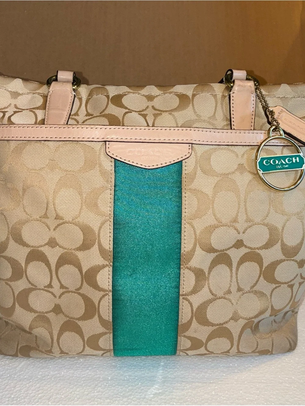 COACH Beige Signature Tote with Teal Center Stripe.